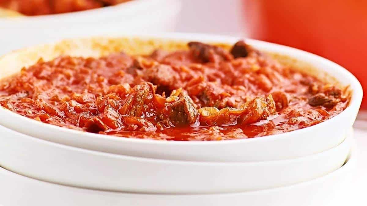 A savory tomato sauce soup with meat.