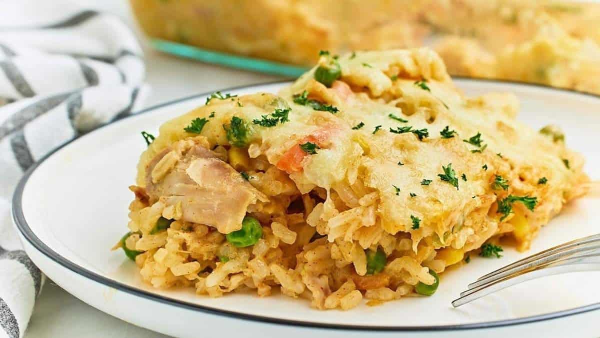 Chicken and rice casserole on a plate with a fork.