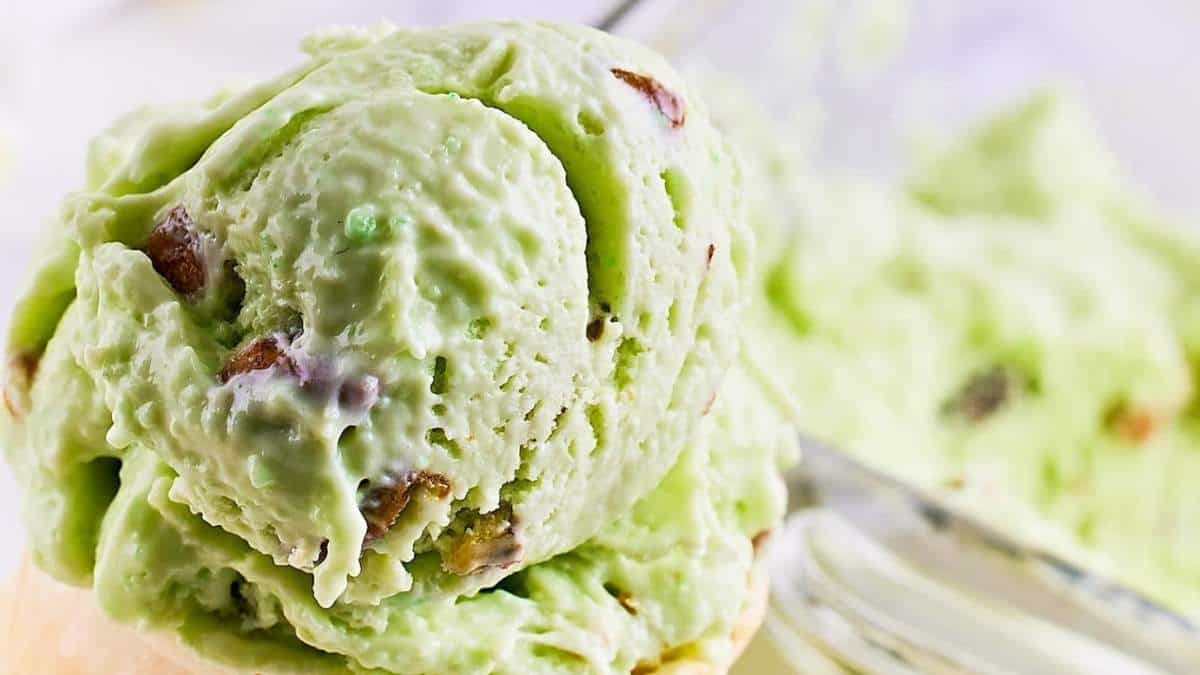 A scoop of green ice cream with pistachios, the perfect no bake dessert option.