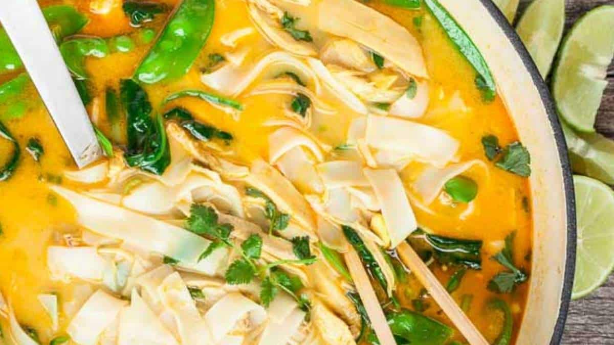 A bowl of thai noodle soup with chopsticks in it. This tantalizing soup is a perfect fusion of flavors and spices, showcasing the best of Thai cuisine. The aromas alone will