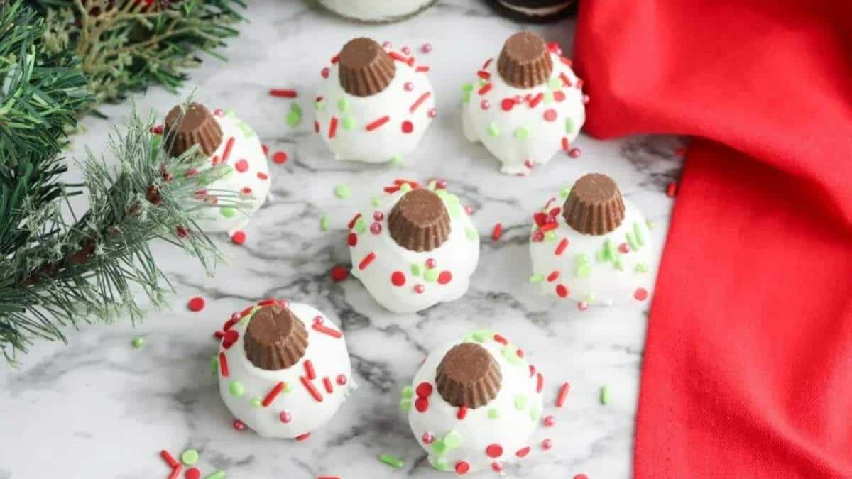Shared Christmas cookies with sprinkles on a marble table.