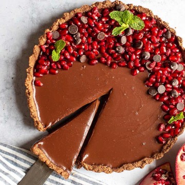 Chocolate pomegranate tart with pomegranate seeds, a sweet pie recipe.