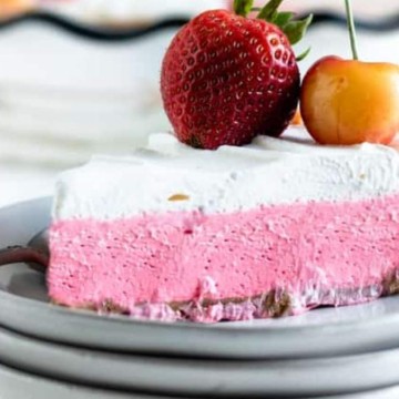 A slice of strawberry ice cream pie on a plate, perfect for those who love no bake desserts.