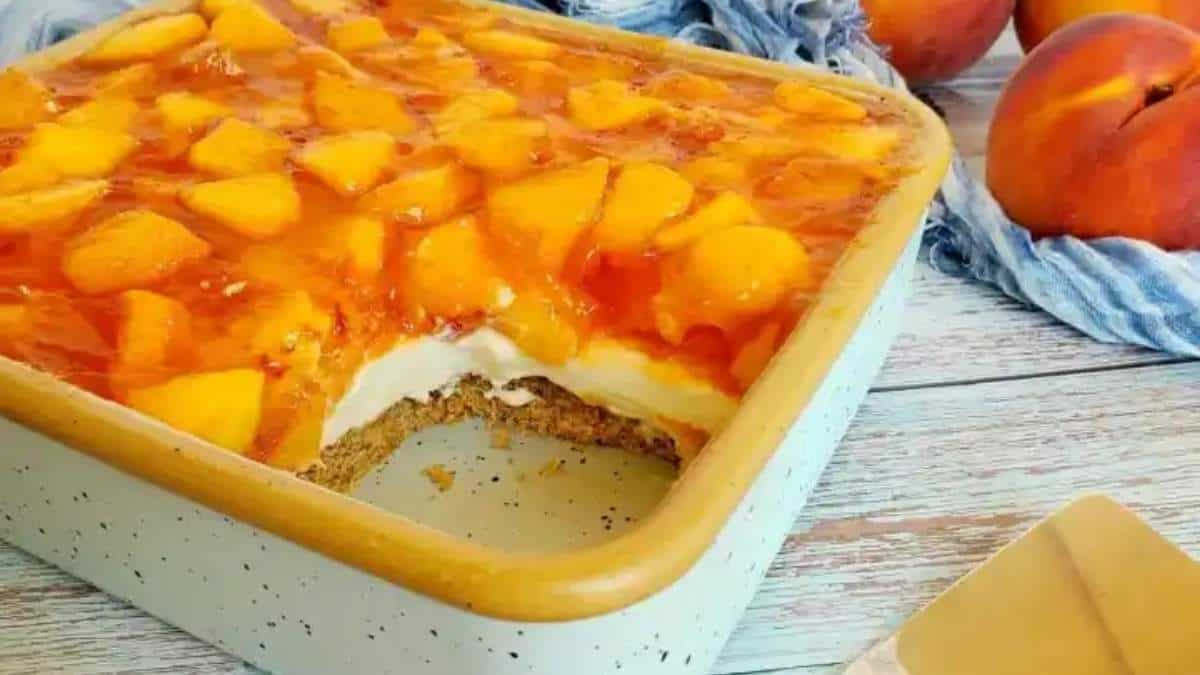 Shared peach cheesecake in a dish with no bake desserts.
