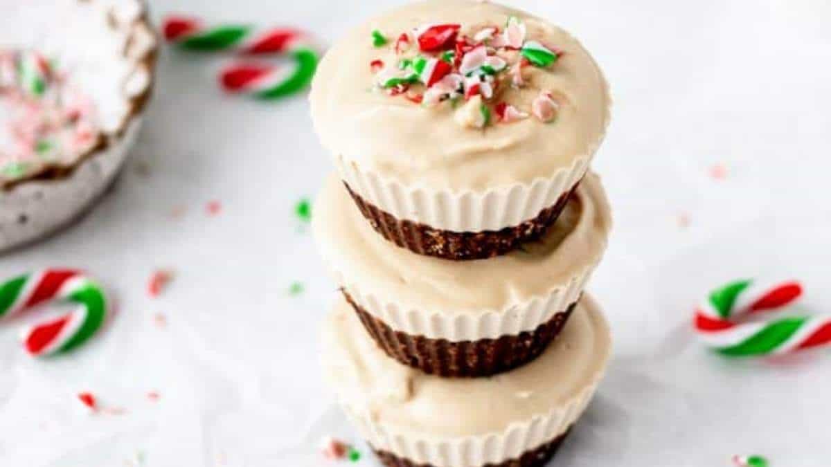 Three shared chocolate peppermint cupcakes stacked on top of each other.
