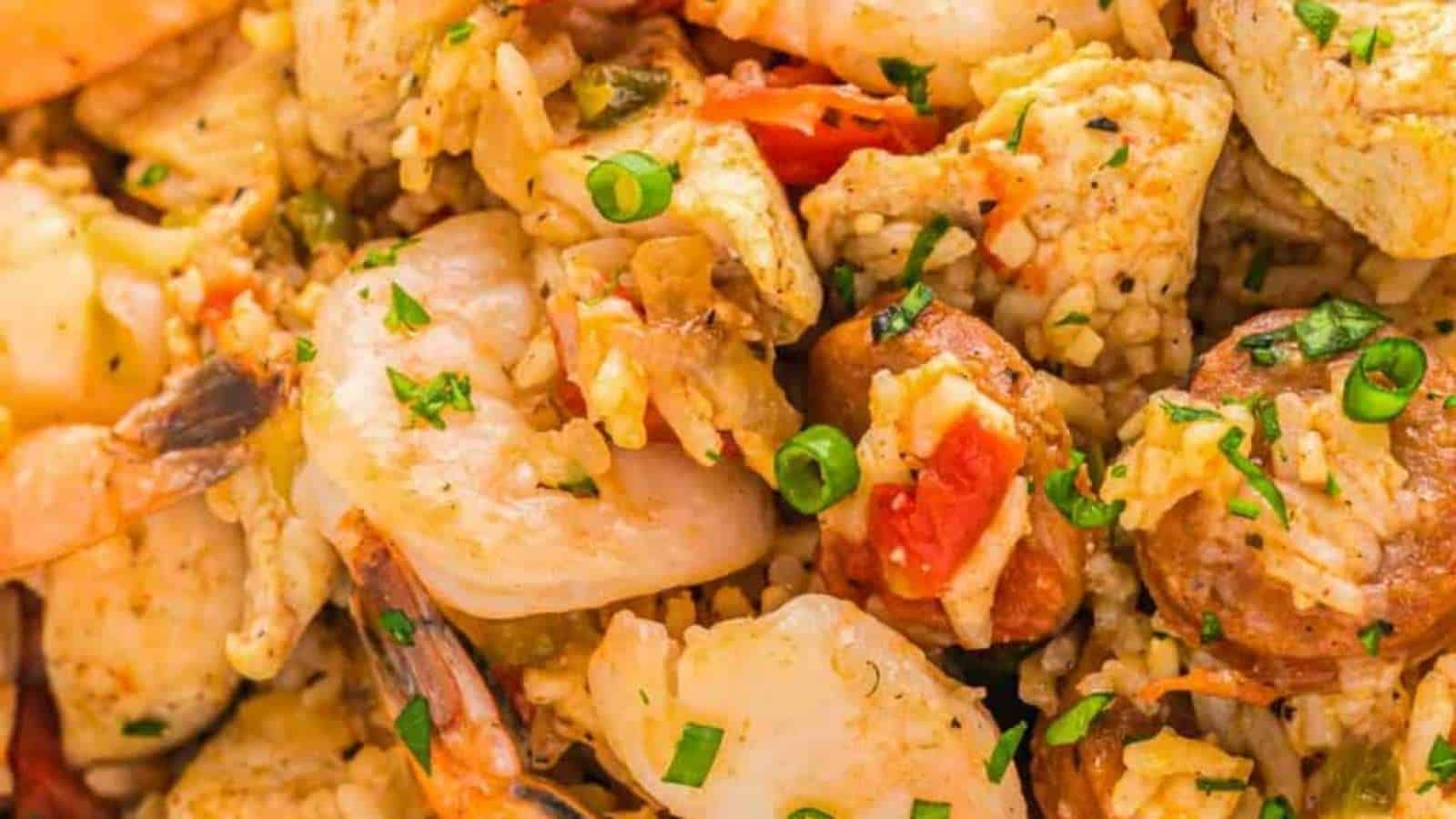 A close up of a dish with shrimp and rice.