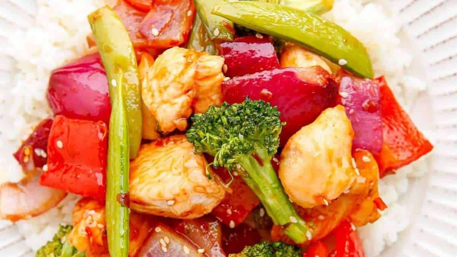 Chicken stir fry with broccoli and red peppers.