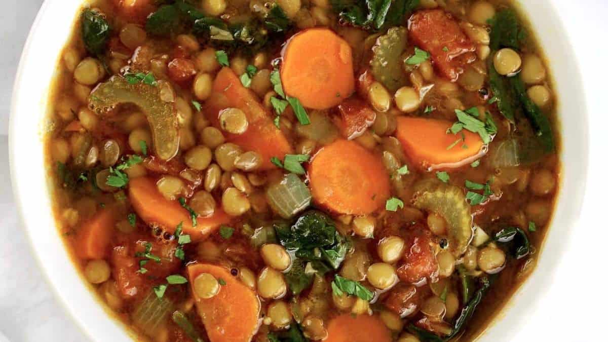A flavorful lentil soup recipe with carrots and spinach.