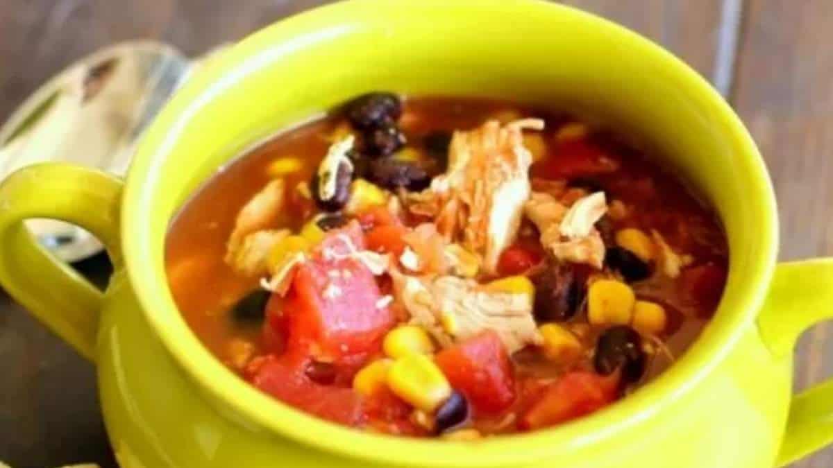 Mexican chicken soup recipe in a green bowl.