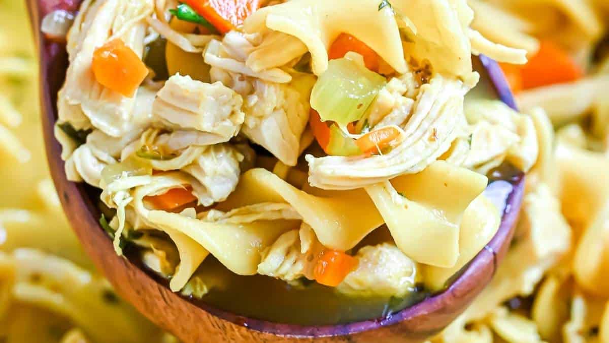 Find delicious soup recipes, including a comforting chicken noodle soup served in a wooden spoon.