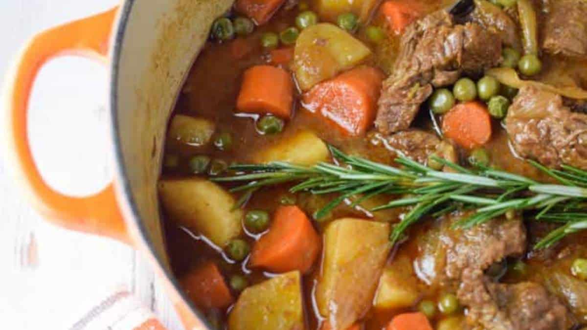 A comforting recipe for beef stew, packed with tender carrots, hearty potatoes, and fragrant rosemary sprigs.