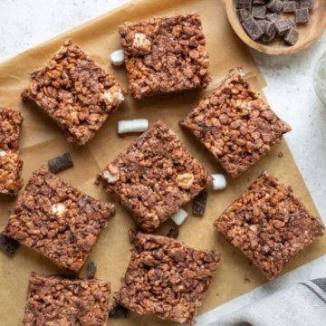 No bake chocolate rice krispie squares shared on a baking sheet.