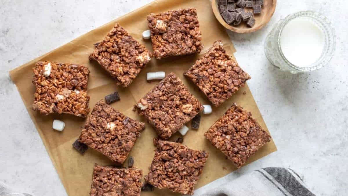 No bake chocolate rice krispie squares shared on a baking sheet.