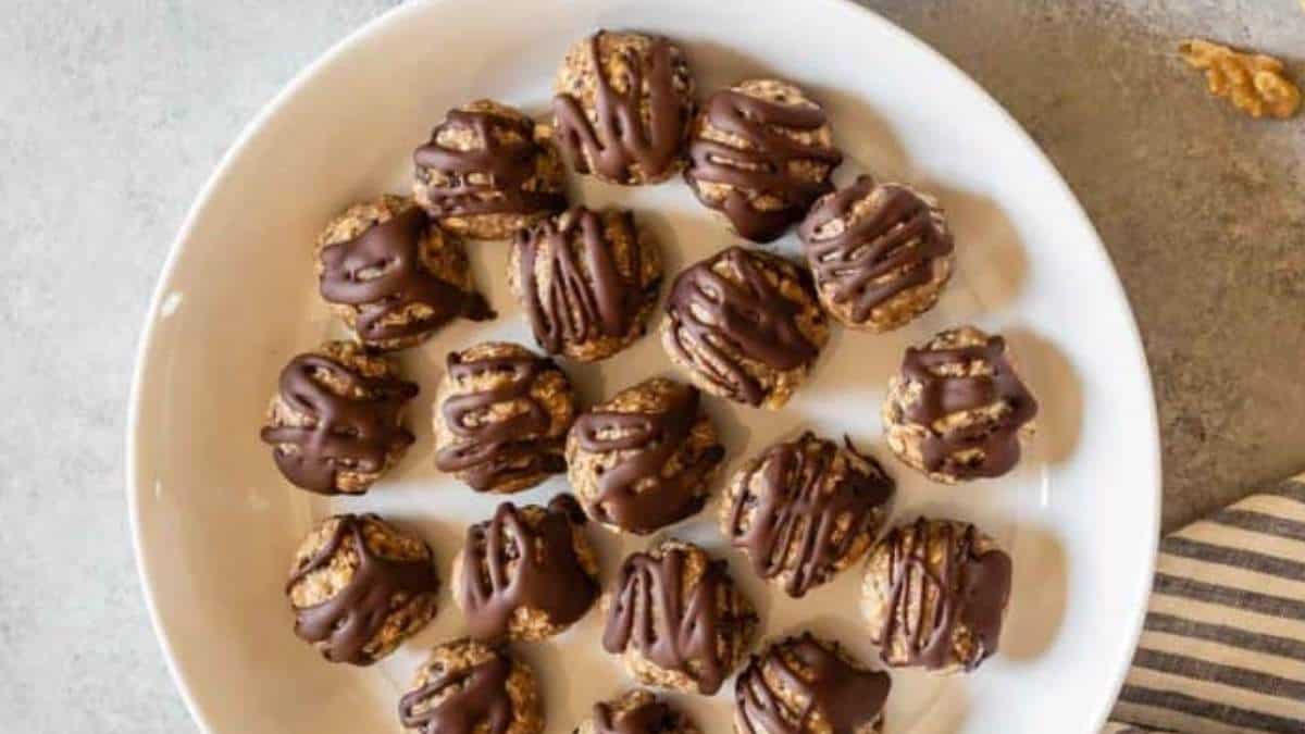 No Bake Desserts - Shared round up of chocolate covered walnuts on a white plate.