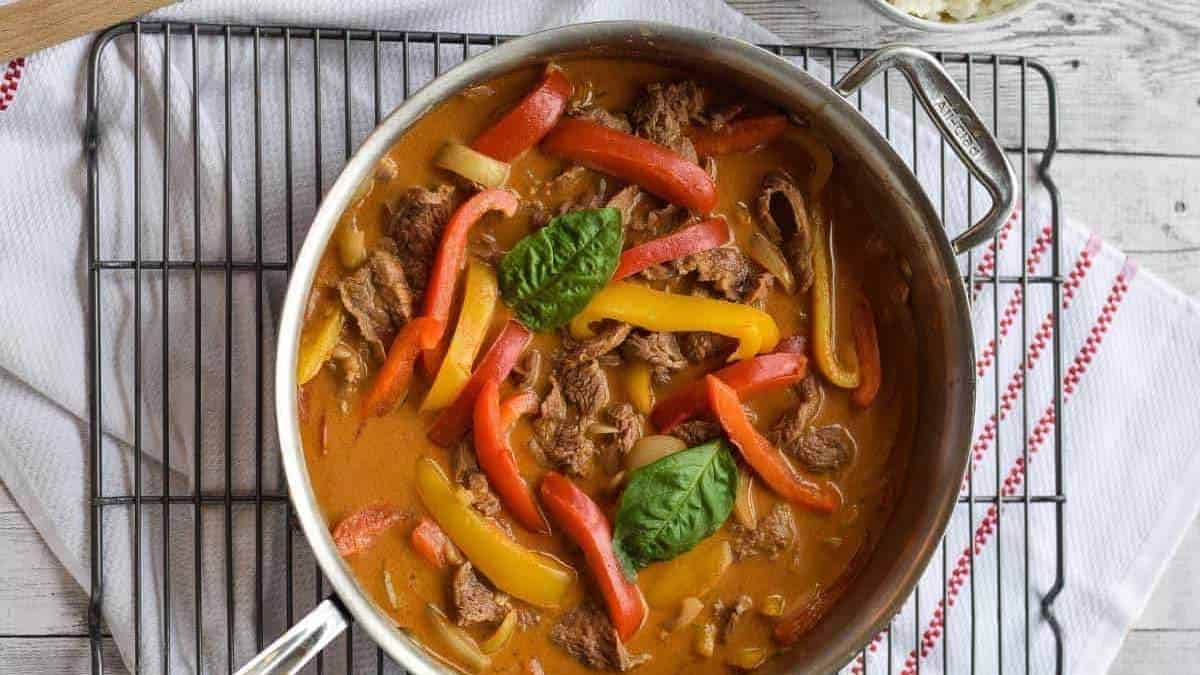 Thai beef curry with peppers and basil, a comforting and delicious dish perfect for any meal. Try out this recipe from our shared round up of comfort food recipes!