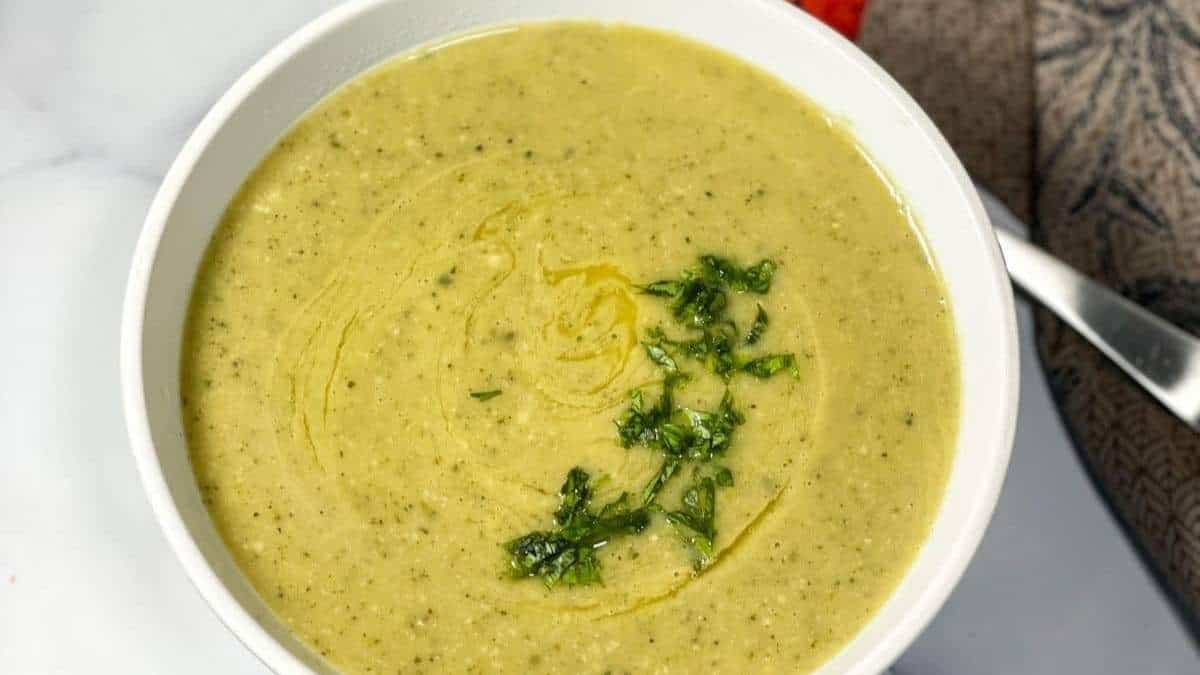 A delicious soup recipe topped with fresh parsley.