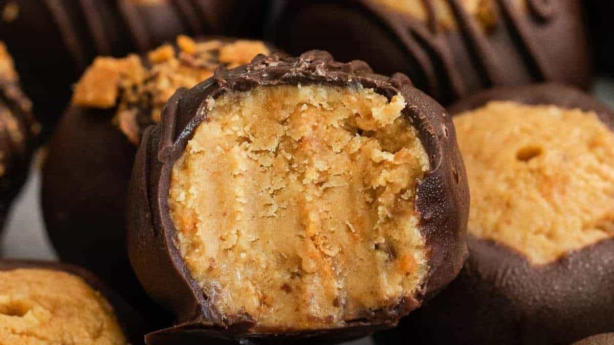 No Bake Peanut Butter Truffles with a bite taken out of them.