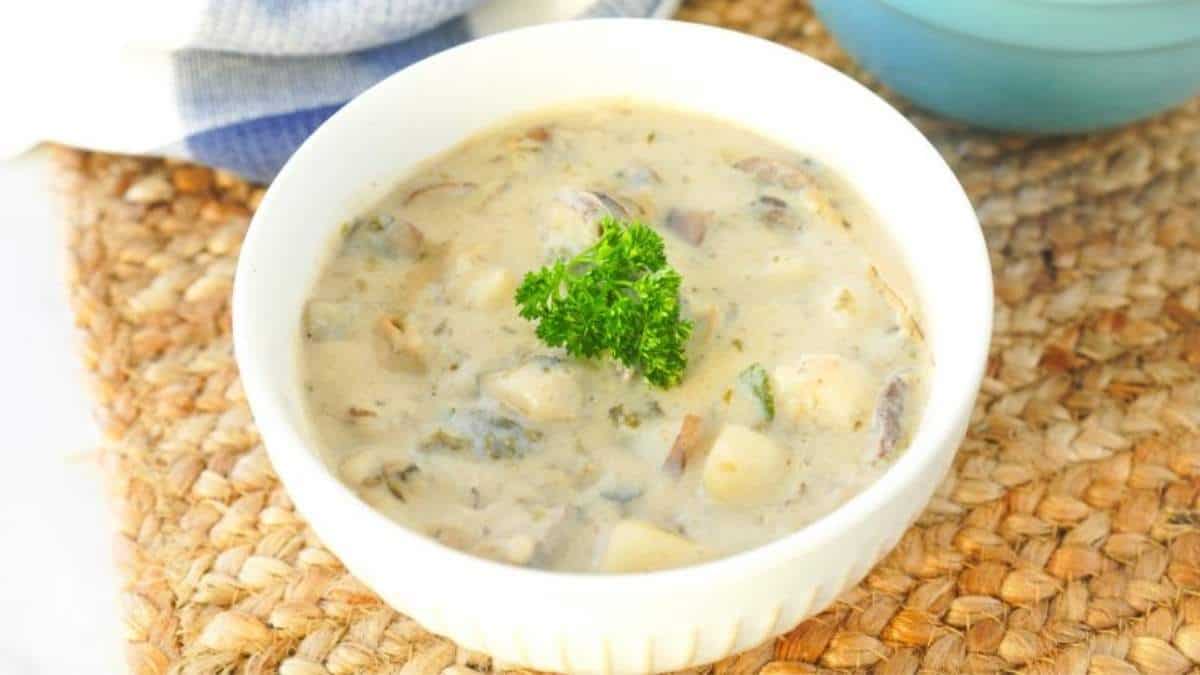 A flavorful soup recipe garnished with fresh parsley.