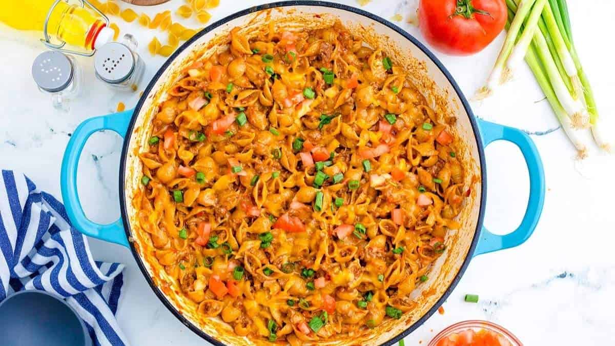 A shared pan of comforting pasta and vegetable recipe on a table.