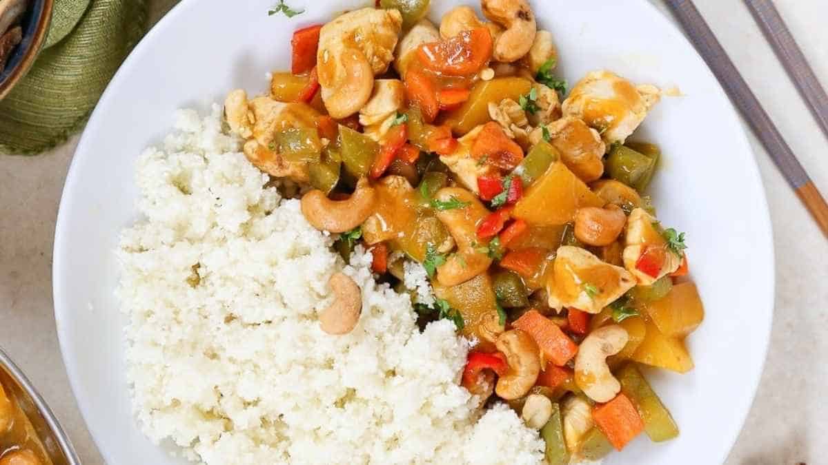 Cashew chicken stir fry with rice and vegetables.