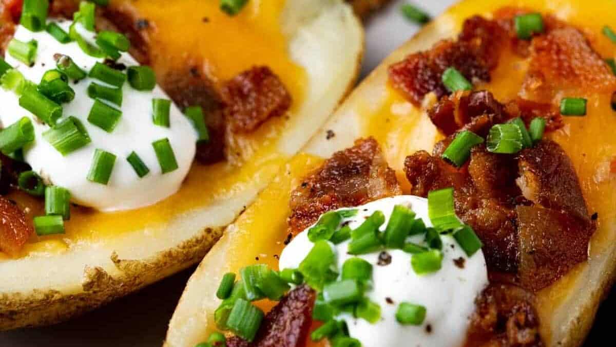 Cheesy potato skins with bacon and sour cream.