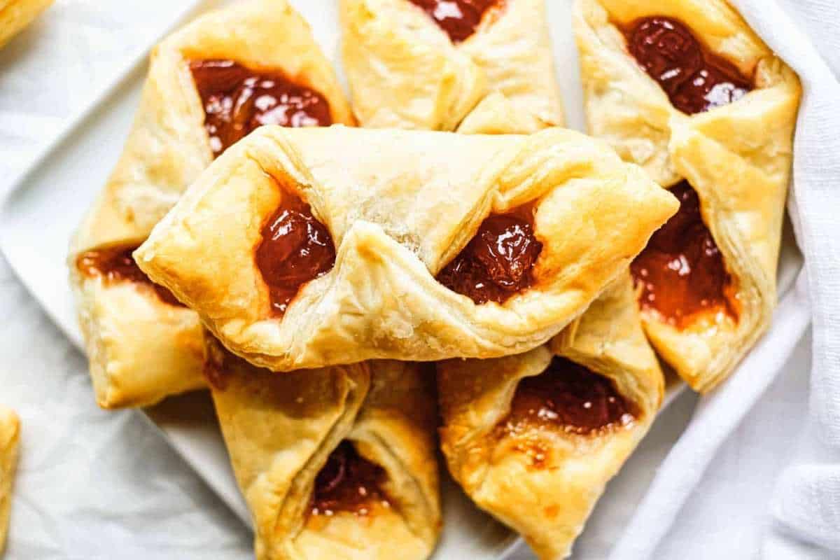 A plate of pastries with jam on it.