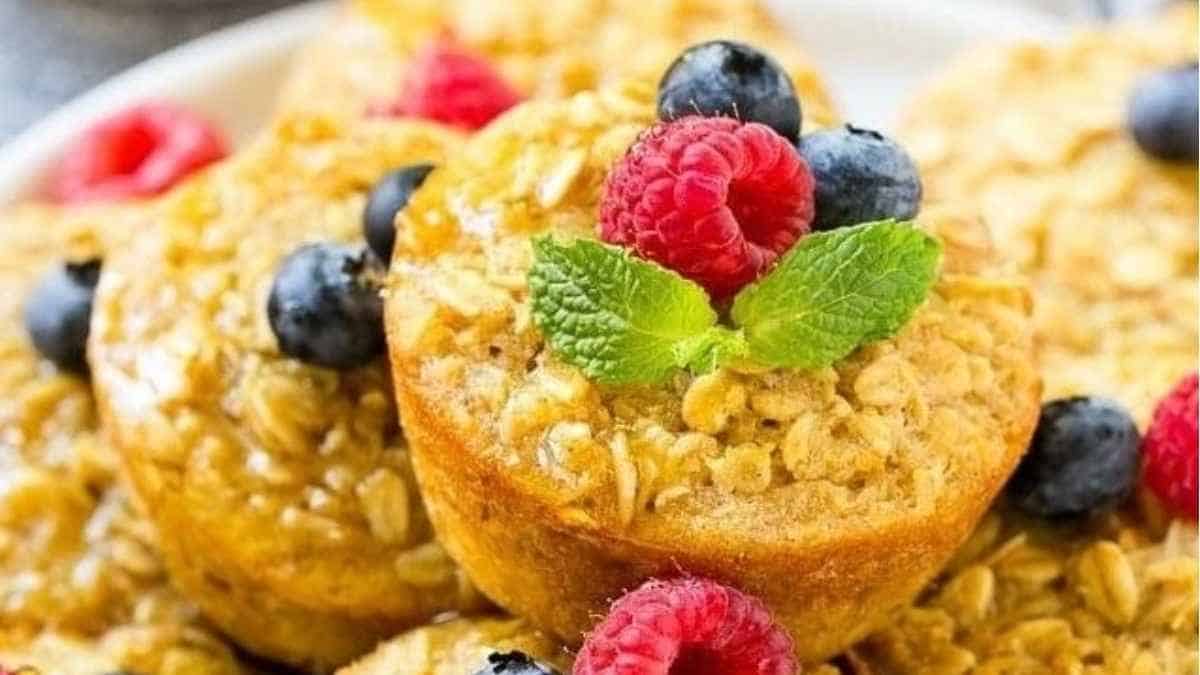 Oat muffins topped with berries and mint.