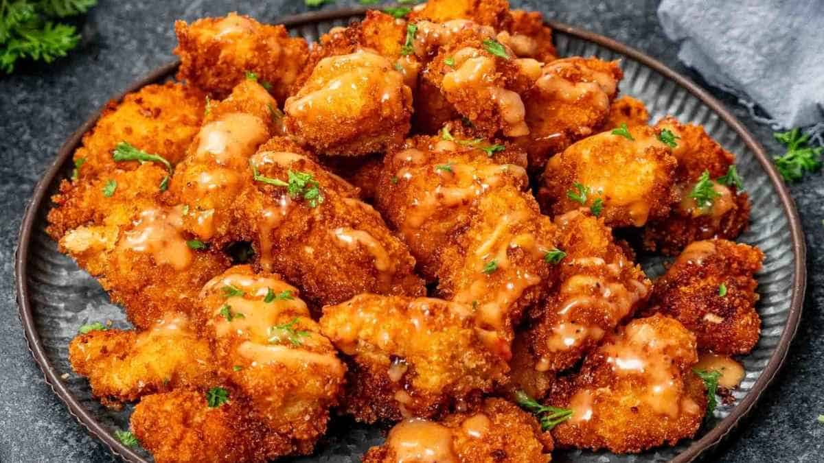 Fried chicken nuggets on a plate.