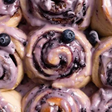 Blueberry cinnamon rolls with icing.