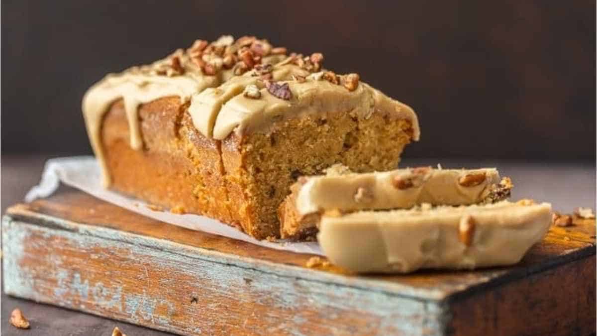 A slice of peanut butter banana bread on a wooden board.