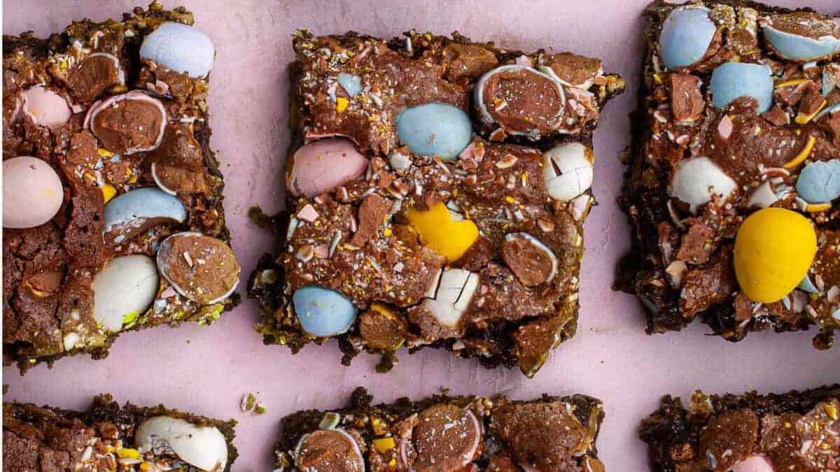 Easter chocolate bars on a pink background.