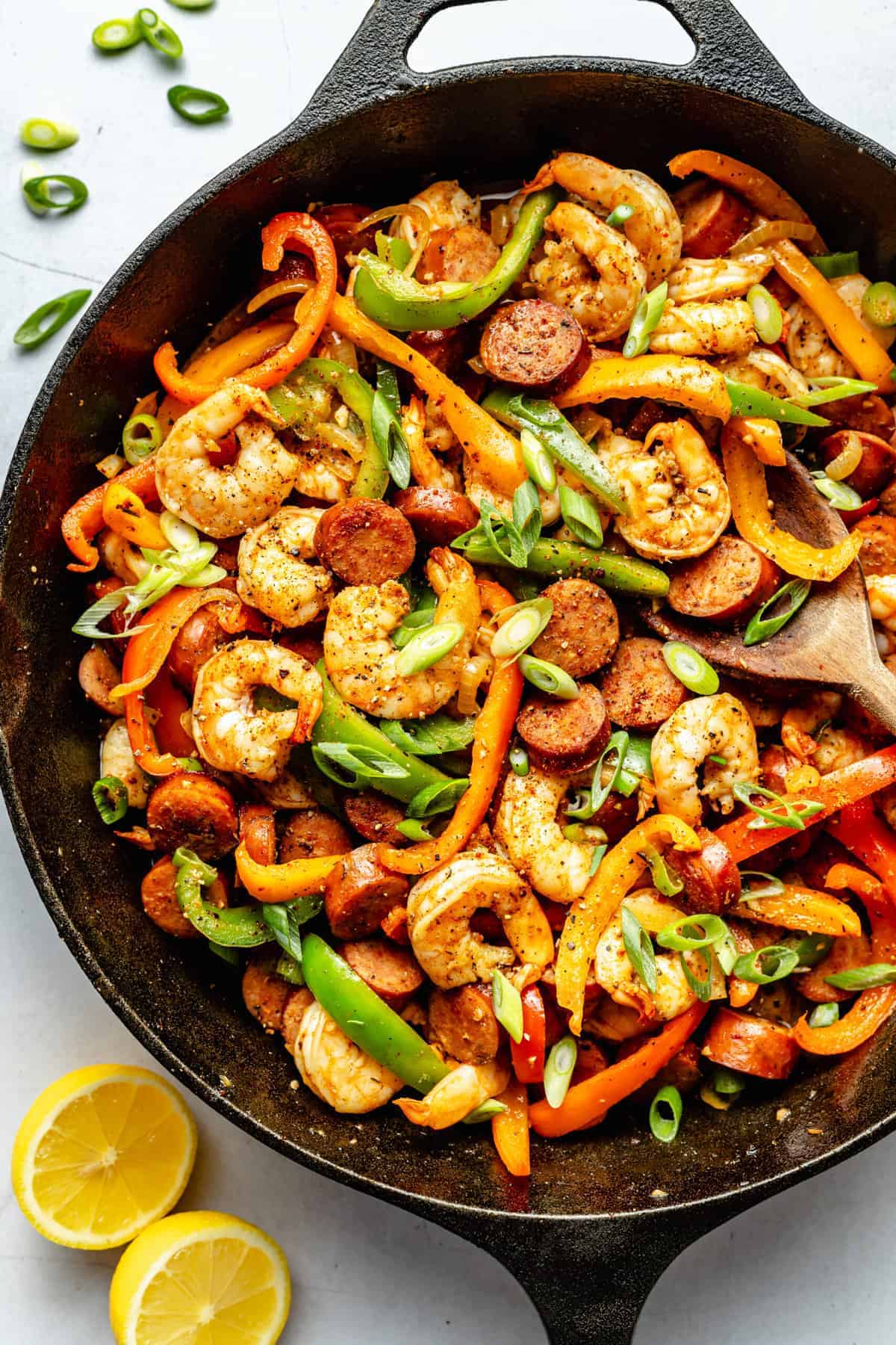 Sausage, shrimp, and peppers in a skillet.