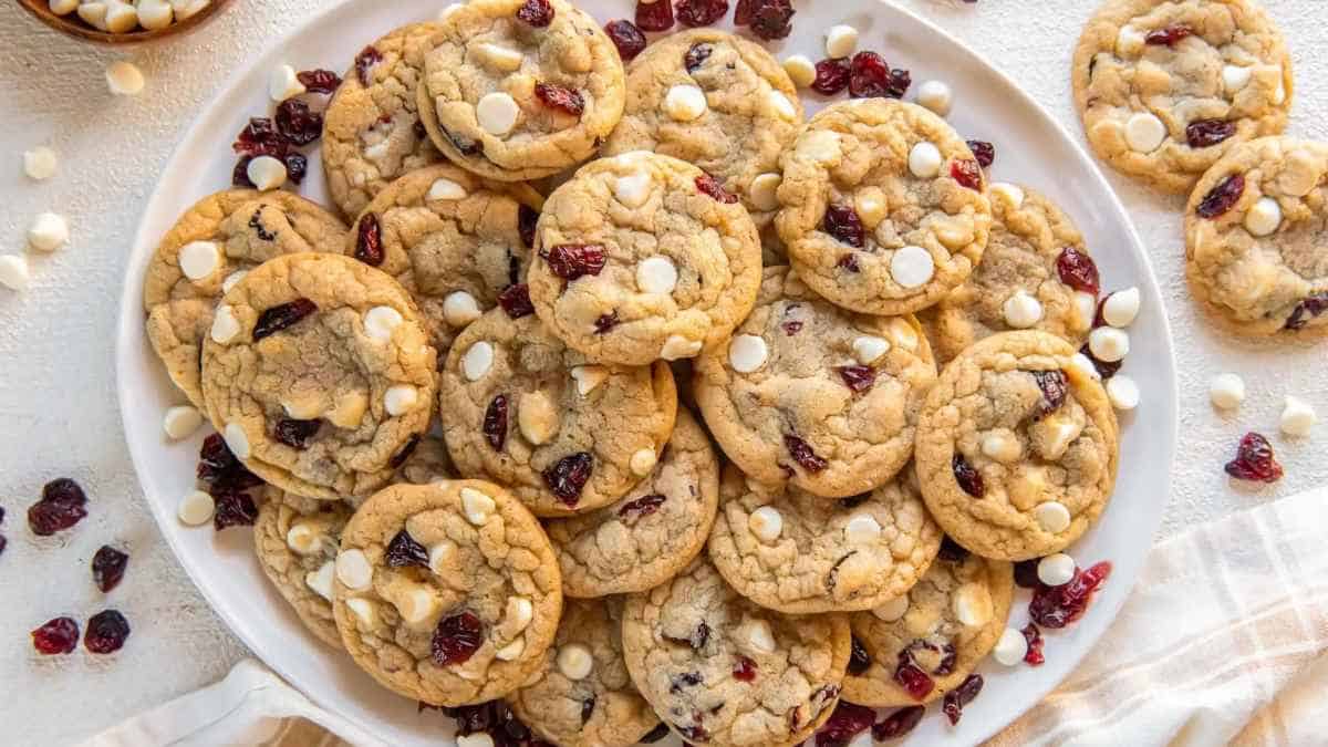 Cranberry white chocolate chip cookies on a plate.