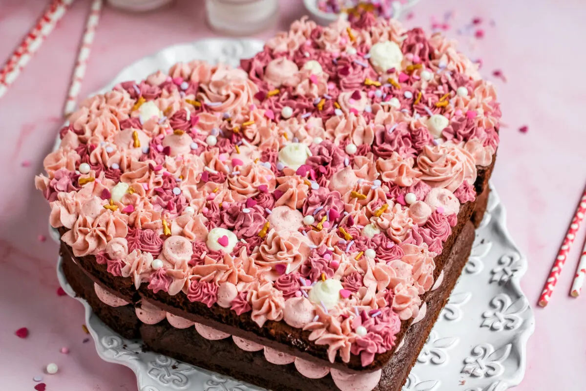 A heart shaped chocolate cake with pink frosting.
