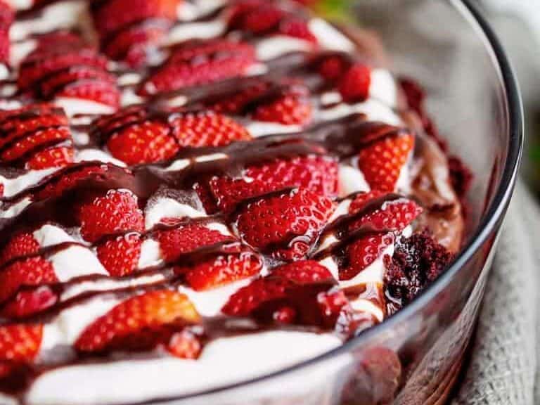 Chocolate strawberry trifle in a glass bowl.