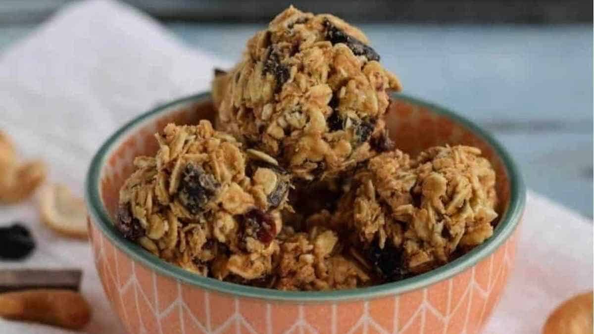 A bowl of granola with raisins and nuts.