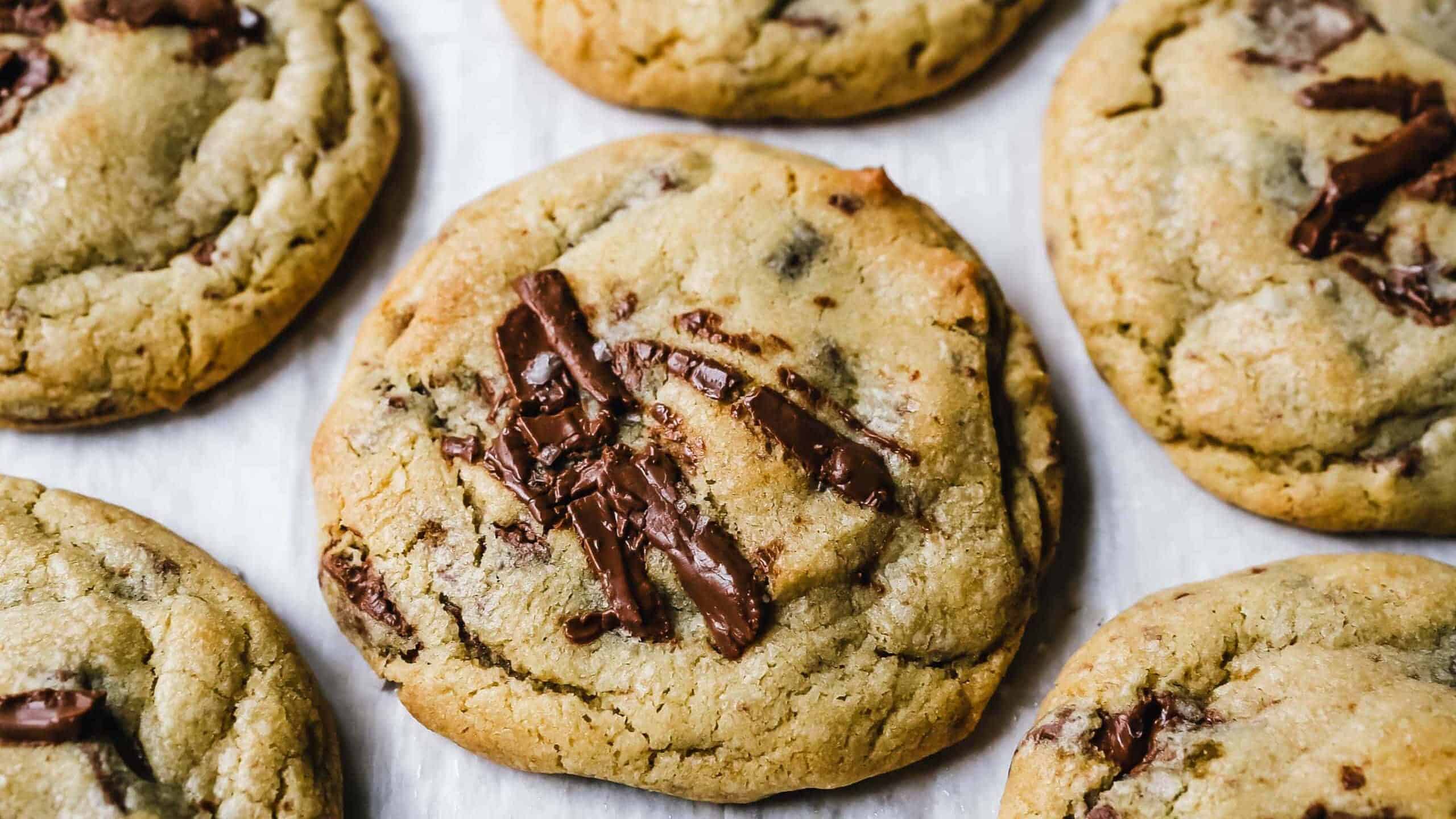 Chocolate chip cookies on a white surface.