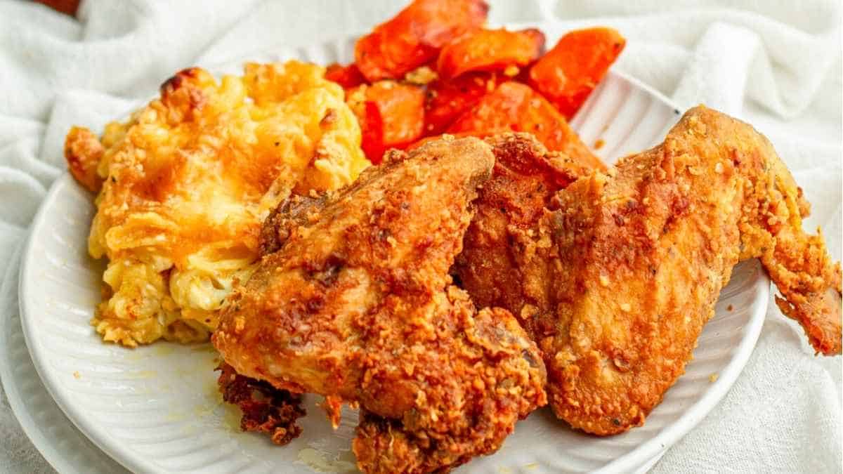 Fried chicken and mashed potatoes on a plate.