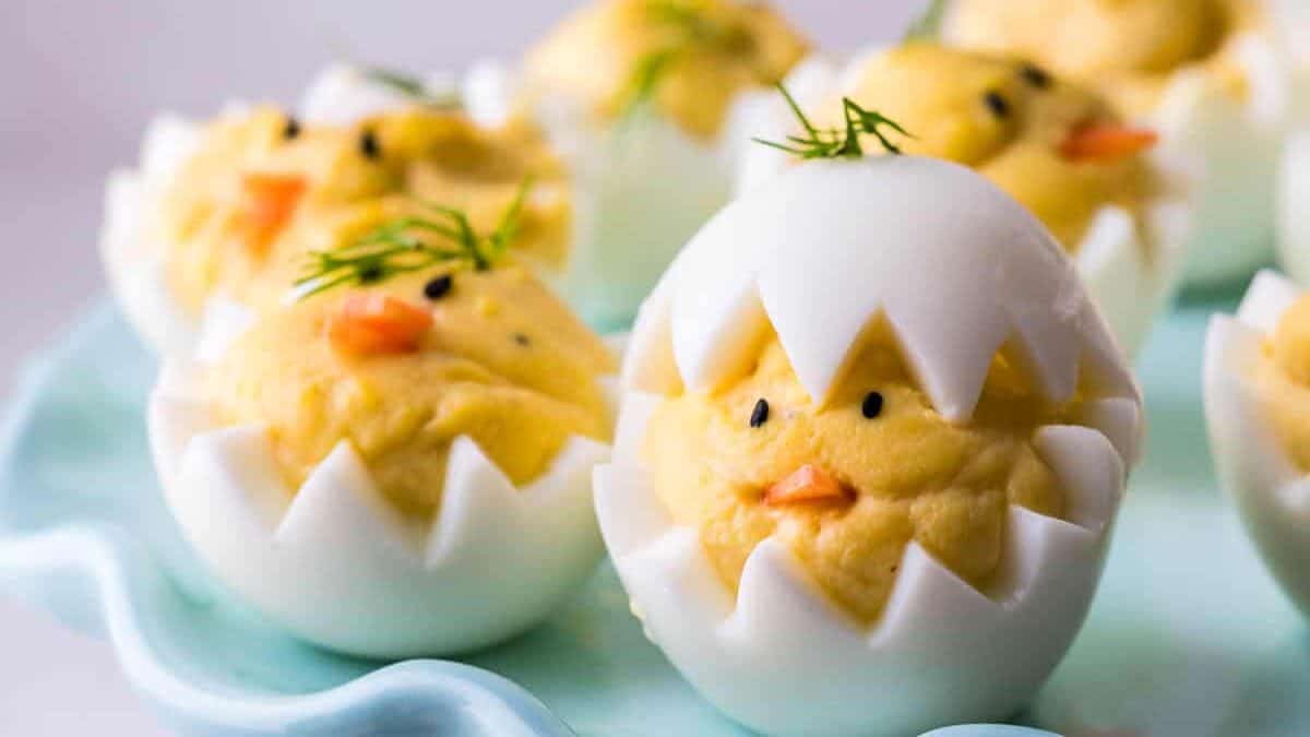 Easter deviled eggs on a blue plate.