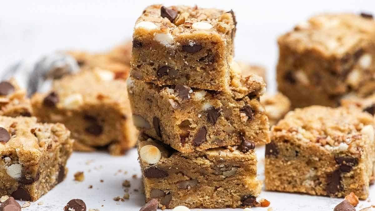 Chocolate chip cookie bars stacked on top of each other.