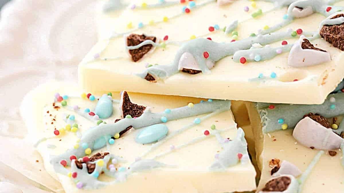 A plate of white chocolate with sprinkles.