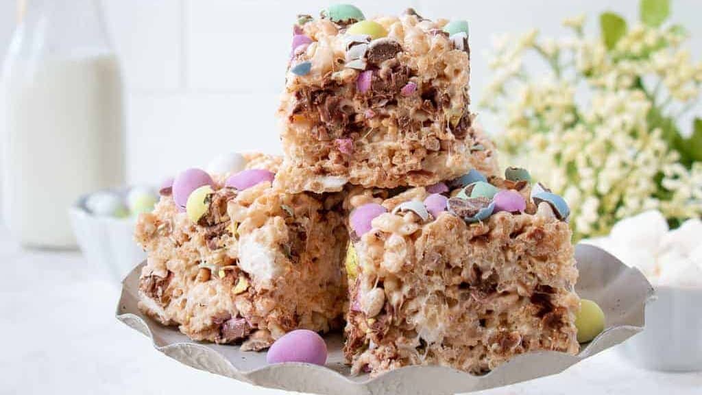 Easter rice krispy treats on a cake stand.
