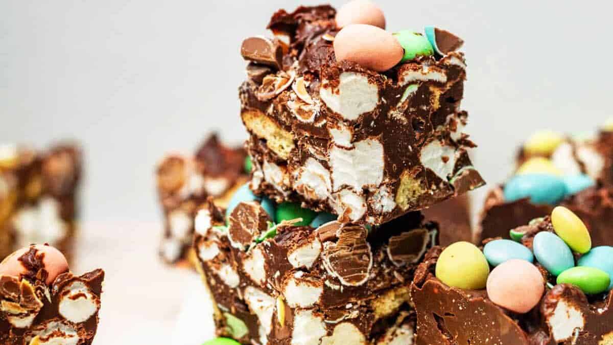 A stack of easter fudge on a cutting board.