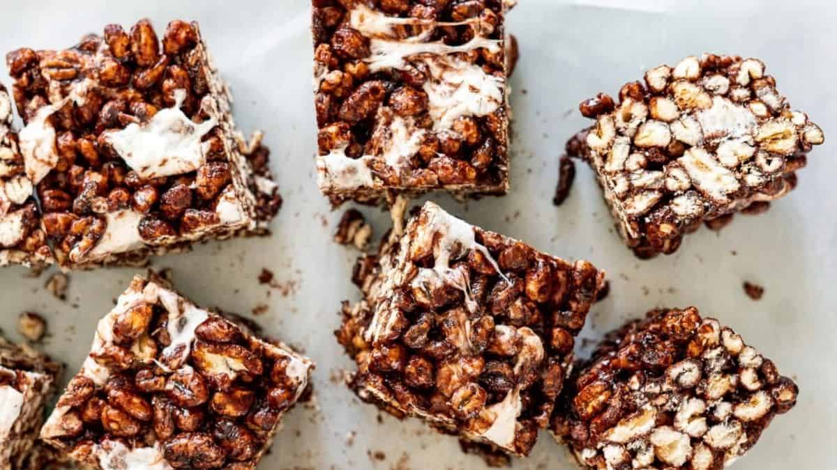 Chocolate peanut butter krispie squares on a baking sheet.