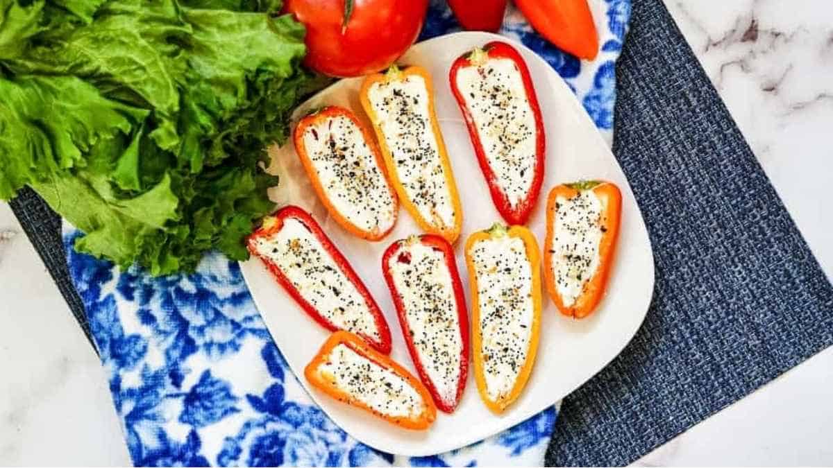 Stuffed peppers with feta cheese on a plate.