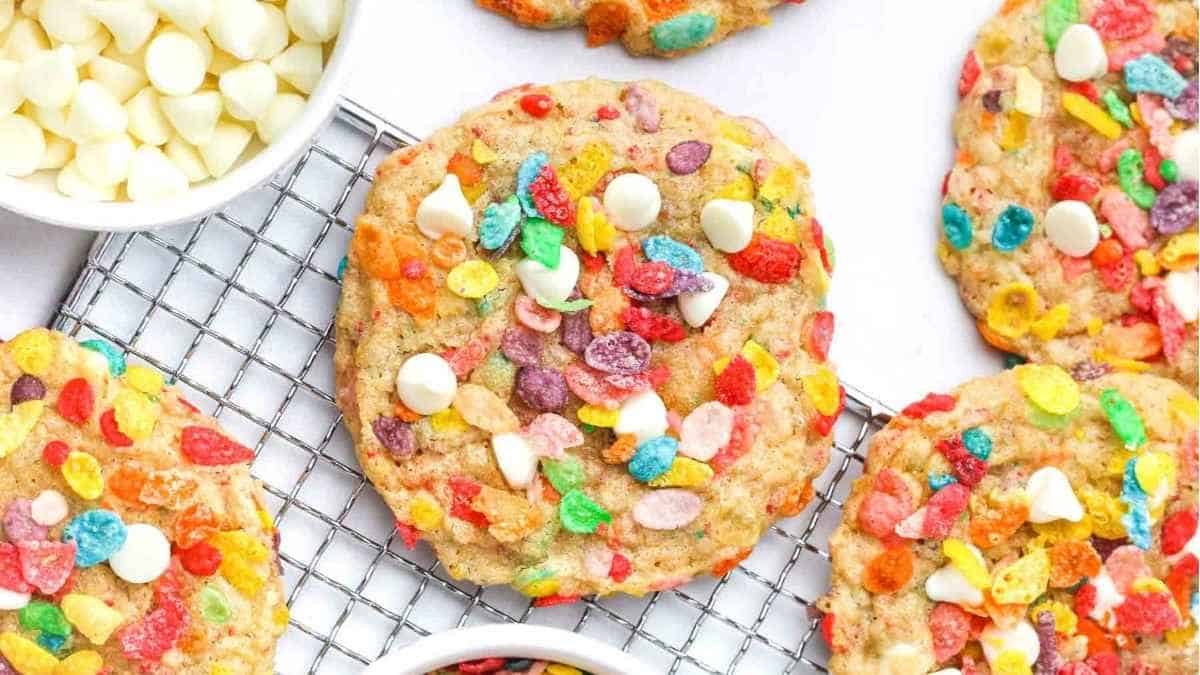 Colorful cereal cookies on a cooling rack.