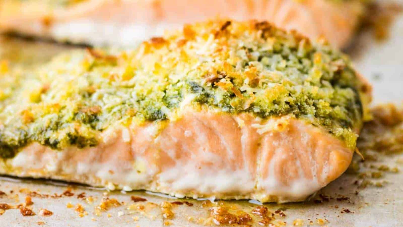 A baked salmon fillet with a cheesy topping.