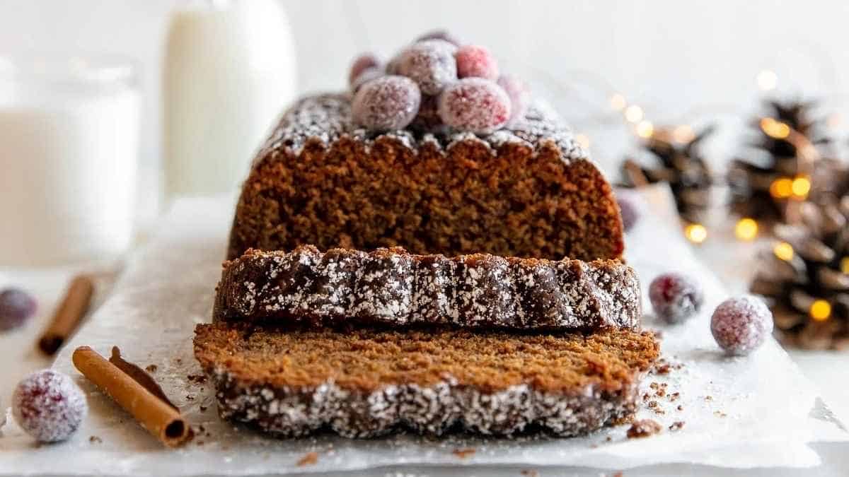 A slice of gingerbread cake on a white plate.