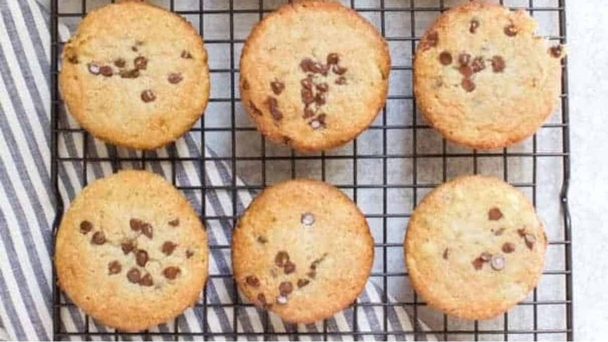 Chocolate chip cookies on a cooling rack.