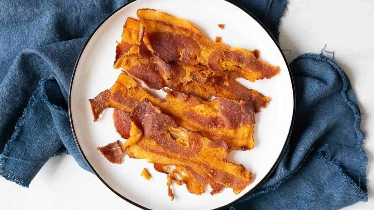 Sliced sweet potato bacon on a plate.